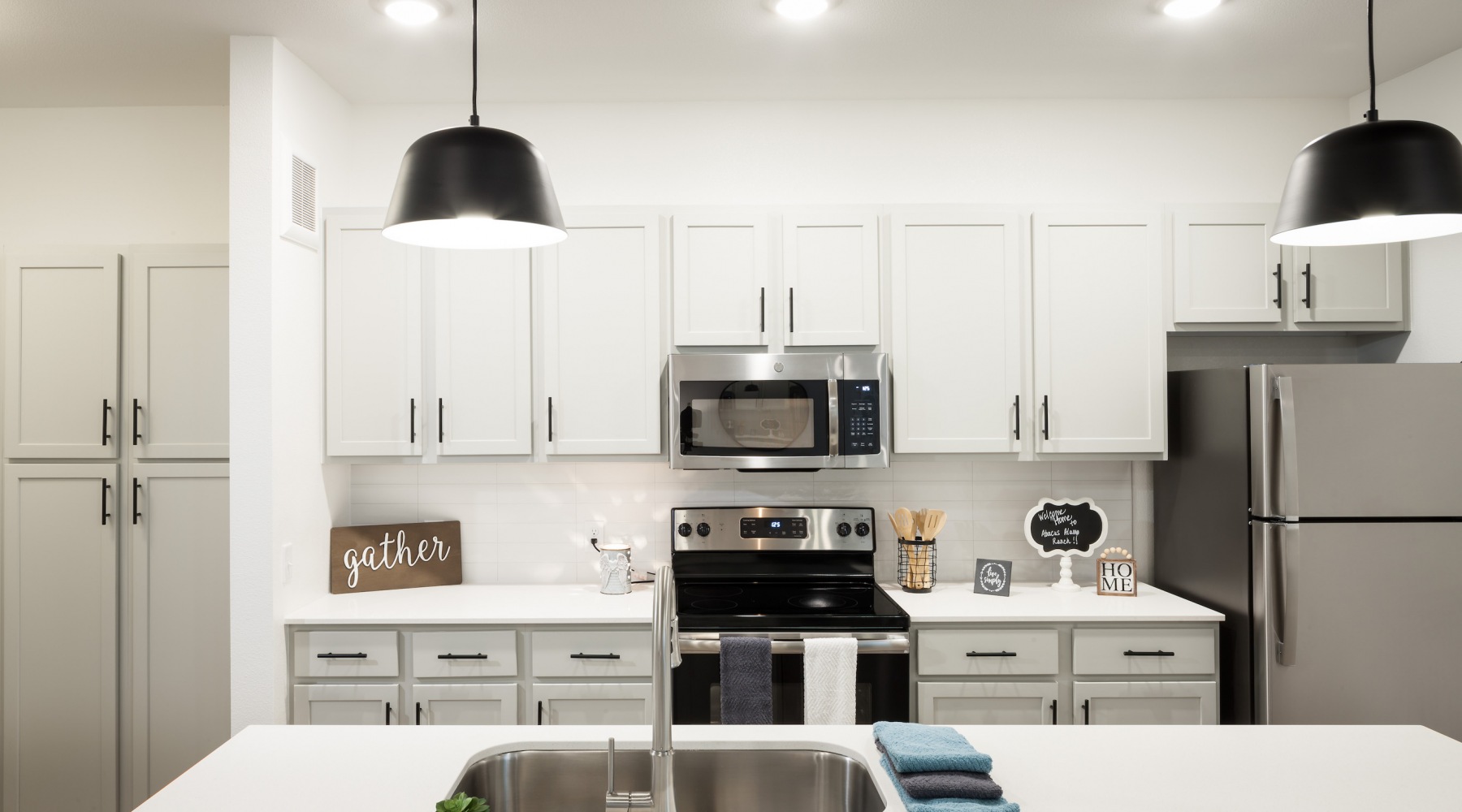 Apartment Kitchens With Modern Lighting And Stainless Steel Appliances At Abacus Alamo Ranch Apartment Kitchens With Modern Lighting And Stainless Steel Appliances At Abacus Alamo Ranch